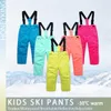 Mamelucos HONEYKING Pantalones de esquí para niños Invierno al aire libre Pantalones de esquí cálidos impermeables Mono para niños y niñas Monos Chándales Pantalones de nieve para niños 231108