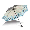 Paraplu's mannen en vrouwen zonnige regenachtige drievoudig zwarte coating UV-bescherming parasol winddichte sterke regen paraplu