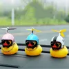 Interior Decorations Automotive Products Gift Broken Helmet Small Yellow Car Decoration Accessories Wind Torn Duck Bicycle Riding Ornament AA230407