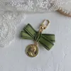 Designer keychain Luxury key chain bag charm female car key ring Pearl charm green ribbon delicate shells keychain couple pendant gift nice good