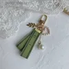 Designer Keychain Luxury Key Chain Bag Charm Female Car Ring Pearl Green Ribbon Delicate Shells Couple Pendant Gift Nice Good UMVI