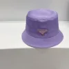 Diseñador de ala ancha de nylon cubo sombreros gorras pescador sombreros para hombres mujeres de moda de lujo protección solar verano playa vacaciones capó casquette algodón forro púrpura