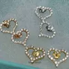 Simple fashion t home 925 Sterling Silver Love Earrings minority design diamond inlaid heart shaped advanced sense earrings temperament