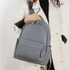 Bolsa de ombro feminina 4 cores estilo universitário mochila de estudante de couro sólido simples Joker em relevo bolsa feminina grande capacidade mochilas de viagem da moda 11032 #