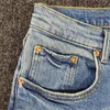 Jean skinny classique taille basse pour homme, teinte indigo moyen, en denim stretch vintage de qualité supérieure
