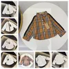 Children's baby designer spring and autumn classic ribbon letter plaid casual shirt long-sleeved shirt style with foreign trade children's wear size 90-160cm A0010