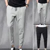 Pantaloni da uomo Pantaloni da uomo alla moda Matita Dstring Tessuto morbido Multi tasche Nono indumento maschile stile giovane