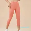 Pantaloni da yoga Capris a vita alta Tasca posteriore da donna Sport nudi Fiess Leggings da palestra Collant da corsa per esercizi