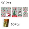 クリスマスデコレーション50pcsプラスチックキャンディーバッグクッキーギフトスノーフレークサンタクロースクリスマスパッケージポーチ年の恩恵