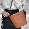 Kobiety torebki CE Podzielone wiadro na płótnie torba kubełkowa torba posłańca skórzana designer CEL Cowhide ma piękną torbę damską 2024 Nowy triumfalny łuk wiadra ba lcn4