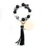 Cross border European and American beaded silicone cross milk cow bead bracelet PU leather tassel keychain wholesale