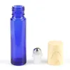 200pcs 10ml 3カラーエッセンシャルオイル空の香水ボトルローラーボール厚いガラスロール材の穀物キャップ付きボトル
