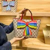 2024 New Designer women's crossbody shoulder can be and mixed batches parent-child children's hand-held personality niche bow hand carry bag