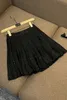 2023 Autumn Black Solid Color Two Piece Dress Sets Long Sleeve Lapel Neck Knitted Beaded Cardigans Sweater With Pleated Short Skirt Set Two Piece Suits Y3N018001