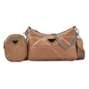 2023 New Top Design Luxury Bags versione di alta qualità tinta unita triangolo cucito tendenza bambino madre semplice catena Messenger