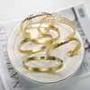 Bracciale JINHUI Bracciale aperto color oro a forma di C di lusso Zircone intarsiato Stella a cinque punte Gioielli da donna di moda in acciaio inossidabile