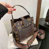 2024 New Designer women's crossbody shoulder trend printing large bucket belt portable personalized diagonal bag