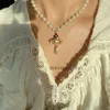 Vivian Saturn colliers perle bijoux occidentaux impératrice douairière tridimensionnelle Saturn gouttelettes d'eau soucoupe volante collier pendentif accessoires