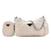 2023 New Top Design Luxury Bags versione di alta qualità tinta unita triangolo cucito tendenza bambino madre semplice catena Messenger