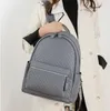 Borsa a tracolla da donna 4 colori zaino da studente in pelle solida stile college semplice borsa da donna in rilievo Joker borsa da viaggio di grande capacità 11032 #