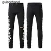 Mężczyźni dżinsy 23ss Nowe chude dżinsy designerskie spodnie RIP Slim Fit with Bone Black Biker Dżins Motorcycle Trendy Knee Otwór Długa prosta dżinsy męskie spodnie