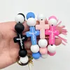 Cross border European and American beaded silicone cross milk cow bead bracelet PU leather tassel keychain wholesale