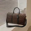 Diseñadores Moda Mujeres Bolsas de lona Hombres de lujo Bolsas de viaje femeninas Bolsos de cuero Bolsos de gran capacidad Bolsa de equipaje para llevar durante la noche Bolsa de fin de semana