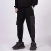 Pantalons pour hommes Hommes fonctionnels multi-poches tendance leggings décontractés 2023 mince couleur unie hip-hop rue simple salopette à neuf points pour hommes