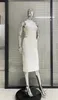 カジュアルドレス2023白い色のセクシーなホローアウトノースリーブミッドカーフドレスシンプルな優雅な女性ボディコン包帯カクテルパーティー衣装