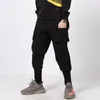 Pantalons pour hommes Hommes fonctionnels multi-poches tendance leggings décontractés 2023 mince couleur unie hip-hop rue simple salopette à neuf points pour hommes