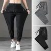 Herenbroeken stijlvolle mannen joggingbroek krimpende manchetten sport mid-rise zomer outdoor ijs zijden jogging zweet absorberend