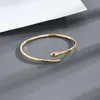 Braccialetto semplice alla moda braccialetto di rame a forma di serpente apertura regolabile dorato retrò testa di serpente braccialetti uomo donna gioielli di personalità 231109