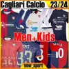 23 24 Cagliari Calcio Retro Futbol Formaları Noel Zola Gobbi 2003 04 05 Joao Pedro Godin Nandez Yüzüncü Erkek Çocuk Kiti Çorapları Tam Setler Futbol Gömlek Erkek Boyutu S-XXL