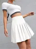 Rokken preppy stijl hoge taille vaste geplooide mini rok dames zomers veer Koreaanse mode schattig wit aline skort y2k strak 230410