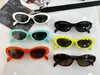 Moda popularny projektant 26 okularów przeciwsłonecznych dla kobiet vintage zabawny kolor cukierki małe okulary słoneczne Summer
