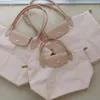 Designer Damen Tote Umhängetasche im europäischen Stil Freizeit Knödel Nylon Handtasche Umhängetasche Falten Stickerei Tote Shopping Mini Bag78
