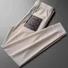 Pantalons de créateur de mode pour hommes, printemps et automne, nouveaux gardes brodés haut de gamme, marque tendance, beau pantalon de sport décontracté de luxe