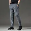 Men's Pants New Trousers Quick-drying Ultra-thin Ice Silk Stretch Slim Pants 5XL Loose Suitable for 120KG Men Walking Soft Casual Sportswear W0411