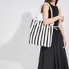 Summer New Stripe Panel Drawstring Tote Bag Casual Large Capacity Fashion Trend Shoulder Bag Oblique Straddle Multi purpose Bag 231111