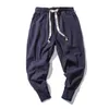 Calça de algodão de algodão de algodão Homens de gola elástica sólida jogadores de streetwear 2022 Novo calças de groth-grotch de largura casual masculino w0414