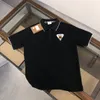 Summer klasyczny designerski designerka koszula polo Tops Man S zwykła klatka piersiowa koszula odzież polo rękawie Mężczyzn ubrania para duży rozmiar s-xl 3 kolor