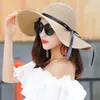 Chapeaux à large bord HT1679 mode chapeau de paille femme soleil dames solide noir ruban arc disquette plage femmes compressible été