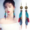 Boucles d'oreilles pendantes bohème longues oreilles pour voyager à travers le monde prendre des glands de plumes Eardrop Yunnan Modification de la personnalité accessoires pour le visage