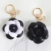 Keychains Cute Pu Leather Camellia Car Keychain Alloy Hanging Tag Rose Flower Bag Pendant Accessories