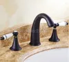 Torneiras de pia do banheiro bacia óleo esfregado bronze preto misturador torneira duas alças 3 furos de água fria lhg082