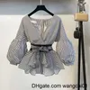 wangcai01女性の2ピースパンツ春夏2 PCSスーツレディースストライプボウランタンセブブラウス +ブラックスプリットフレアセブパンツセット