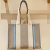 Hochwertige Damenhandtasche Woody Tote Einkaufstasche Handtaschen 10A Leinen Canvas Große Strandtaschen Designer Reise Umhängetasche Umhängetasche Geldbörse Briefriemen-Einkaufstasche