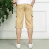 Mäns shorts Men Multi-Pocketed Kne-Längd i Khaki Black Navy Army Green Side Pockets Design Short Pants Summer Style Daily Wear