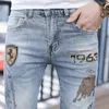 Station européenne 2023 Automne/Hiver Marque de mode Golden Bull Hot Diamond Jeans brodés pour hommes Slim Fit Light Small Foot Pants