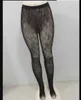 Seksowne długie pończochy Kobiety moda czarno -białe cienkie rajstopy miękka pusta litera ciasna majtki
